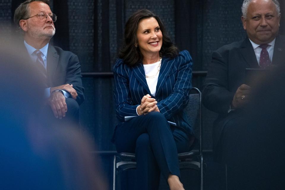 Michigan Governor Gretchen Whitmer sits between U.S. Senator Gary Peters, left, and Secretary of the U.S. Navy Carlos Del Toro during an M3 Initiative event at the Macomb Community College Sports and ExpoCenter in Warren, MI on Monday, July 22, 2024.