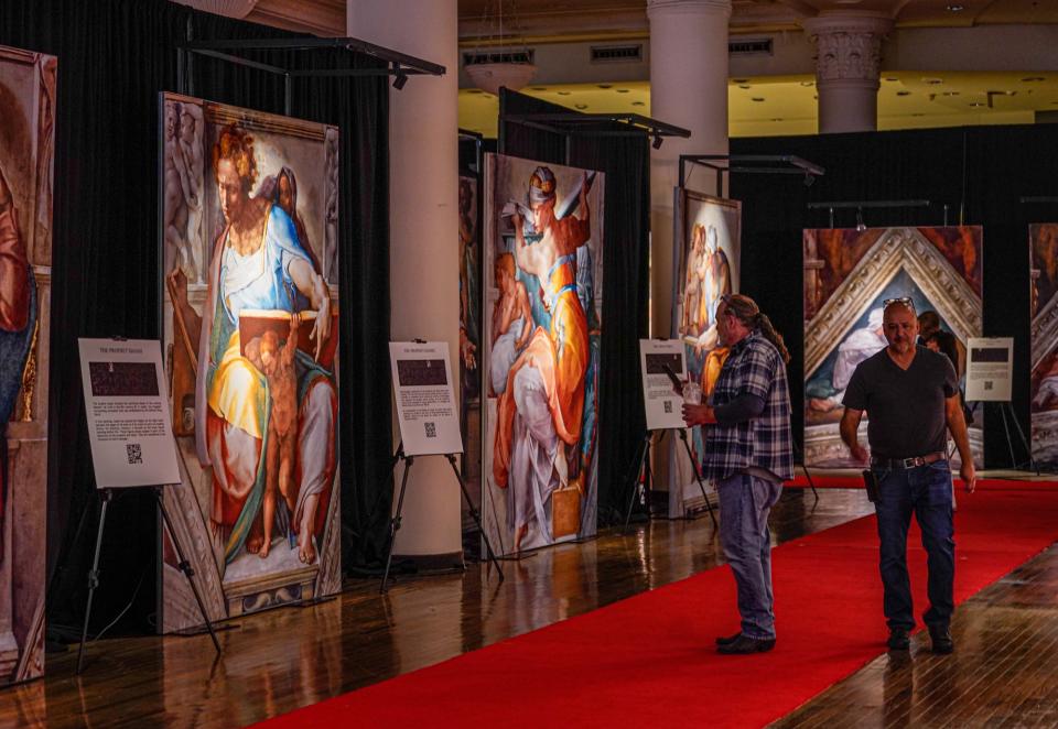 Guests view a traveling exhibit titled Michelangelo's Sistine Chapel, The Exhibition on Friday, July 8, 2022, inside the former Carson's Dept. Store in Circle City Mall in Indianapolis. 