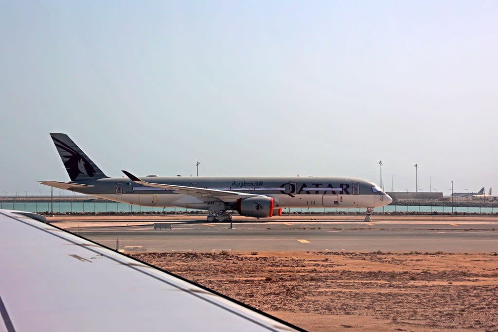 File: A Qatar Airways aircraft is seen on the tarmac at Hamad International Airport in Doha  (AFP via Getty Images)