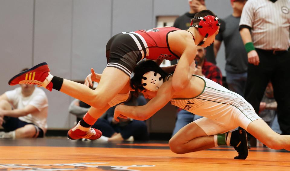 Whitman-Hanson's PJ Katz, left, won the 113 pound finals wrestling match versus Duxbury's Noah Price during Division 2 South Sectionals on Saturday, Feb. 10, 2024.