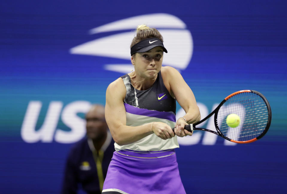 FILE - In this Sept. 5, 2019, file photo, Elina Svitolina, of Ukraine, returns a shot to Serena Williams during the semifinals of the U.S. Open tennis championships in New York. Two more top-10 women -- Elina Svitolina and Kiki Bertens -- will miss the U.S. Open, joining No. 1-ranked Ash Barty in skipping the Grand Slam tennis tournament during the coronavirus pandemic. Svitolina posted Friday, Aug. 7, 2020, on social media that she doesn’t “feel comfortable to travel to US without putting my team and myself at high risk.”(AP Photo/Adam Hunger, File)