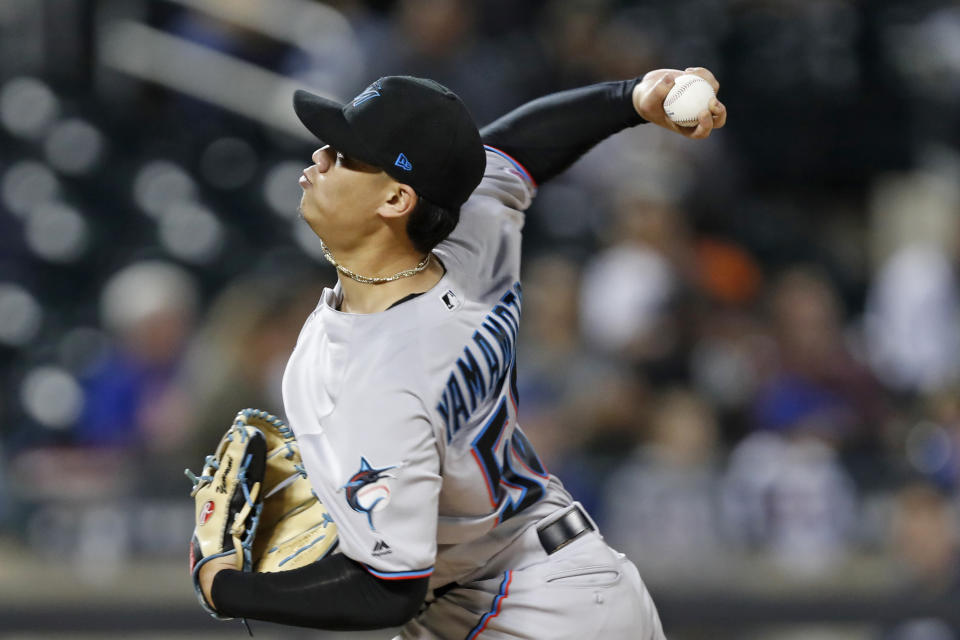 Miami Marlins starting pitcher Jordan Yamamoto winds up during the third inning of a baseball game against the New York Mets, Thursday, Sept. 26, 2019, in New York. (AP Photo/Kathy Willens)