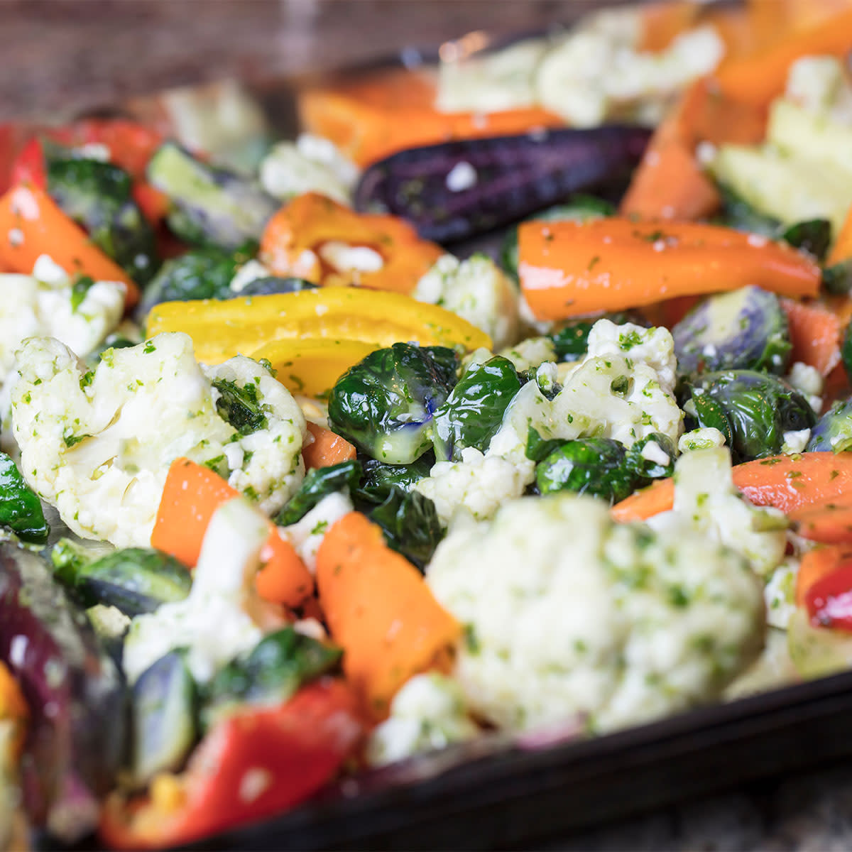 pan of roasted carrots, cauliflower, and other veggies