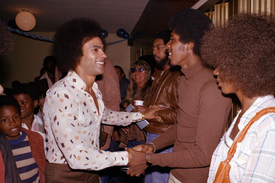 FILE - In this July 23, 1977, file photo, former Black Panther leader Huey Newton is greeted by friends and well-wishers at a rally after his release on bail in Oakland, Calif. (AP Photo/John Storey, File)