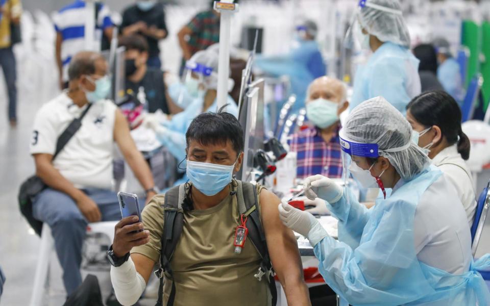 Thai health officials administer AstraZenca vaccines in a race with rising cases - DIEGO AZUBEL/EPA-EFE/Shutterstock