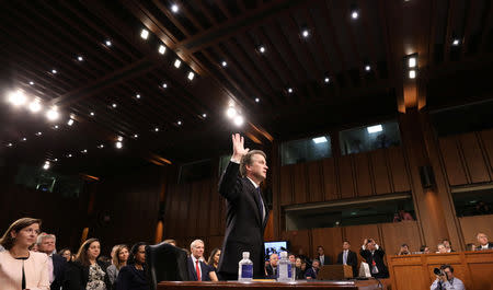 U.S. Supreme Court nominee Judge Brett Kavanaugh is sworn in to testify at his U.S. Senate Judiciary Committee confirmation hearing on Capitol Hill in Washington, U.S., September 4, 2018. REUTERS/Chris Wattie