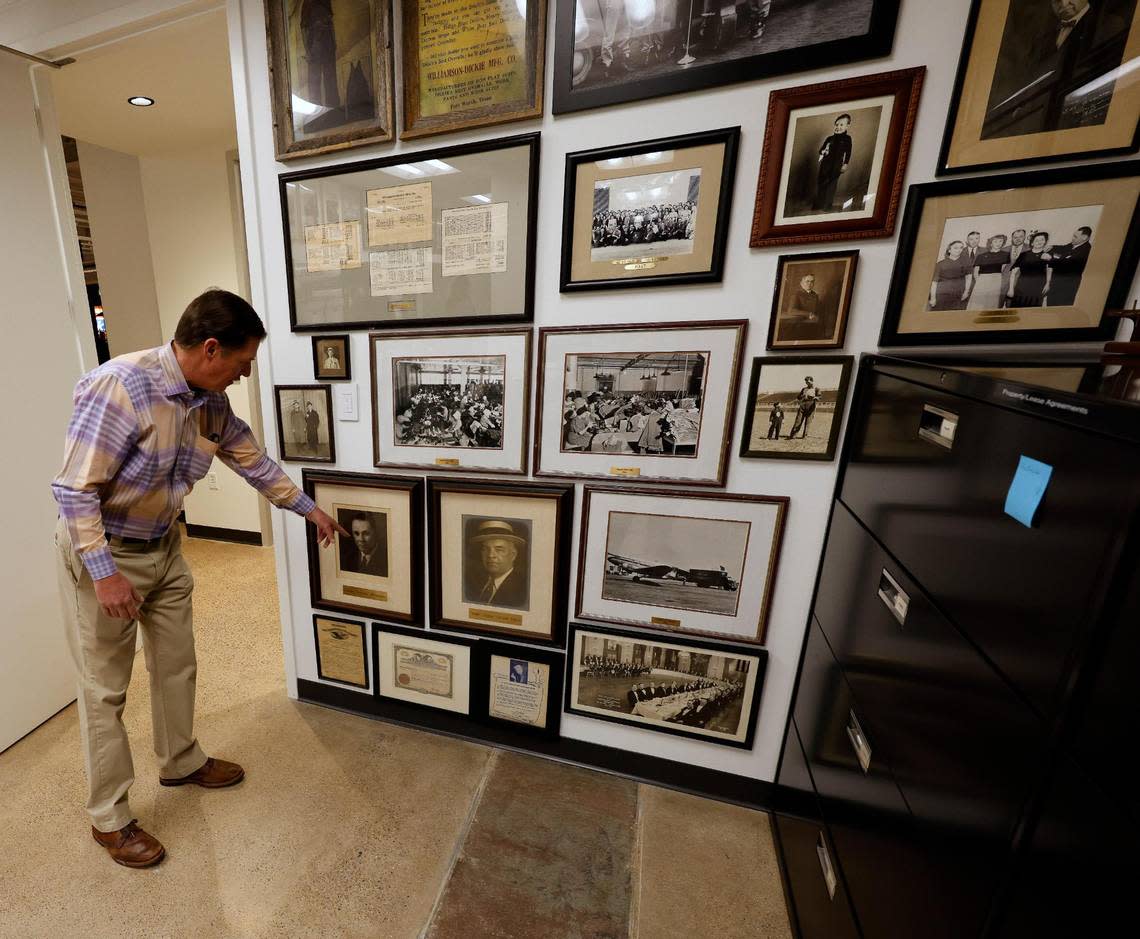 Brand Ambassador Philip Williamson points out his grand father and great grandfather in an archives room at Dickies offices in downtown Fort Worth Texas, Thursday Mar. 28, 2024. The 102 year old work apparel company recently relocated to downtown Fort Worth. (Special to the Star-Telegram Bob Booth) Bob Booth/Special to the Star-Telegram Bob Booth