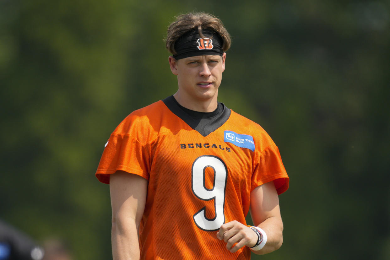 FILE - Cincinnati Bengals quarterback Joe Burrow (9) takes part in a drill during practice at the team&#39;s NFL football training facility, Tuesday, June 6, 2023, in Cincinnati. Burrow has reported to training camp amid negotiations for a long-term contract with the team that&#39;s expected to make him one of the NFL&#39;s highest paid players.(AP Photo/Jeff Dean, File)