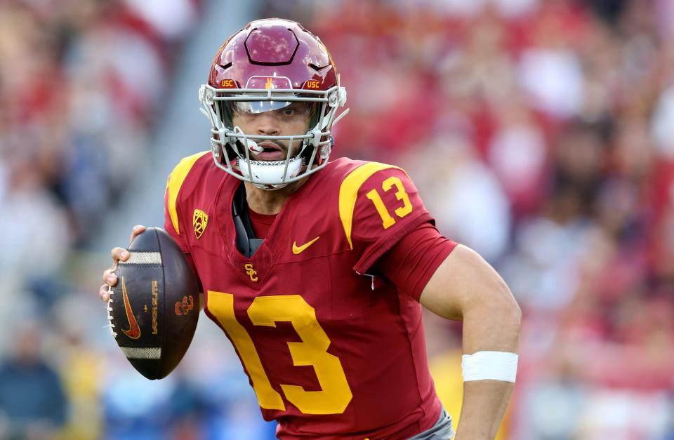 USC Trojans quarterback Caleb Williams (13) scrambles during the second quarter against the UCLA Bruins at United Airlines Field at Los Angeles Memorial Coliseum on Nov. 18, 2023.