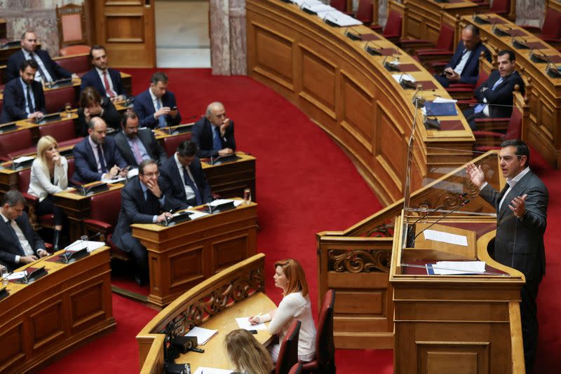 Greek opposition SYRIZA party leader Alexis Tsipras addresses lawmakers during a parliamentary session on a wiretapping case