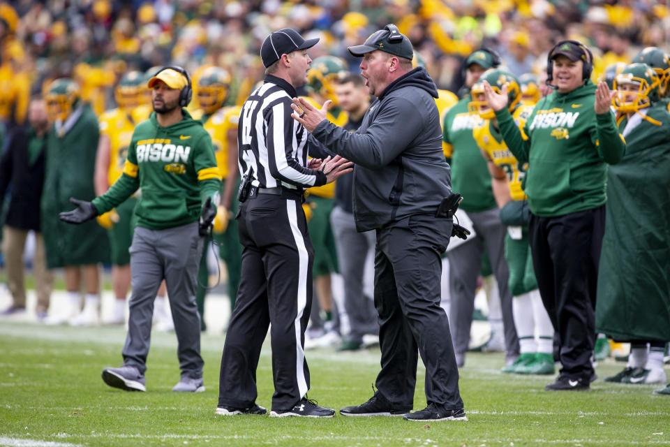 North Dakota State head coach Matt Entz speaks with an official after a touchdown scored by his team was overturned in the first half of the FCS championship NCAA college football game against James Madison, Saturday, Jan. 11, 2020, in Frisco, Texas. (AP Photo/Sam Hodde)