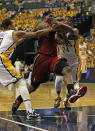 INDIANAPOLIS, IN - MAY 17: LeBron James #6 of the Miami Heat drives between George Hill #3 and Paul George #24 of the Indiana Pacers in Game Three of the Eastern Conference Semifinals in the 2012 NBA Playoffs at Bankers Life Fieldhouse on May 17, 2012 in Indianapolis, Indiana. NOTE TO USER: User expressly acknowledges and agrees that, by downloading and/or using this photograph, User is consenting to the terms and conditions of the Getty Images License Agreement. (Photo by Jonathan Daniel/Getty Images)