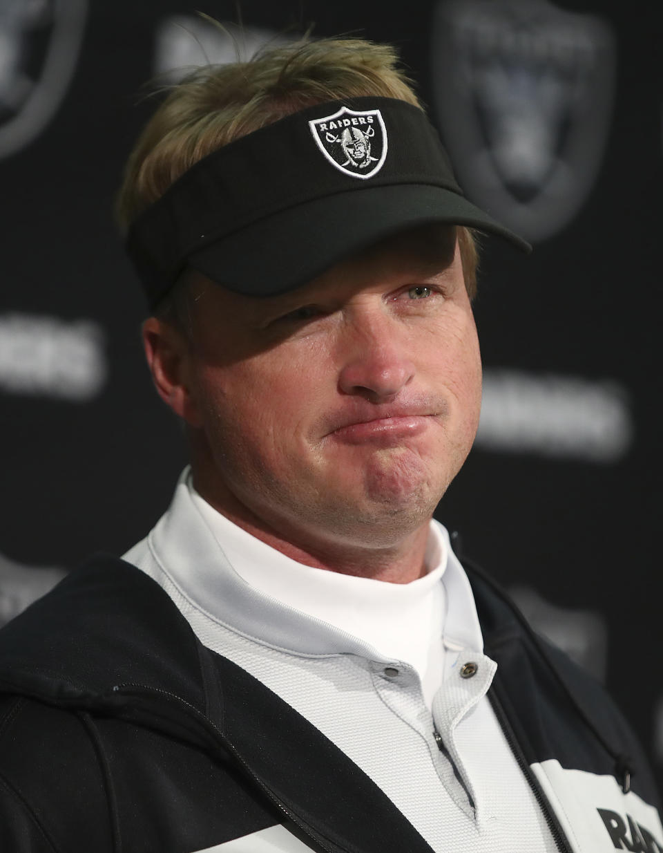 FILE - Oakland Raiders head coach Jon Gruden speaks at a news conference after an NFL football game against the Pittsburgh Steelers in Oakland, Calif., Sunday, Dec. 9, 2018. The Nevada Supreme Court has pushed back to Jan. 10 the date for oral arguments in a contract interference and conspiracy lawsuit filed against the NFL by former Las Vegas Raiders coach Jon Gruden. The hearing had been scheduled Tuesday.(AP Photo/Ben Margot, File)