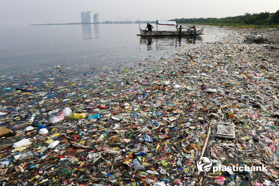 Floating plastic waste clogging a shoreline. - Credit: Courtesy of Davines Group and Plastic Bank