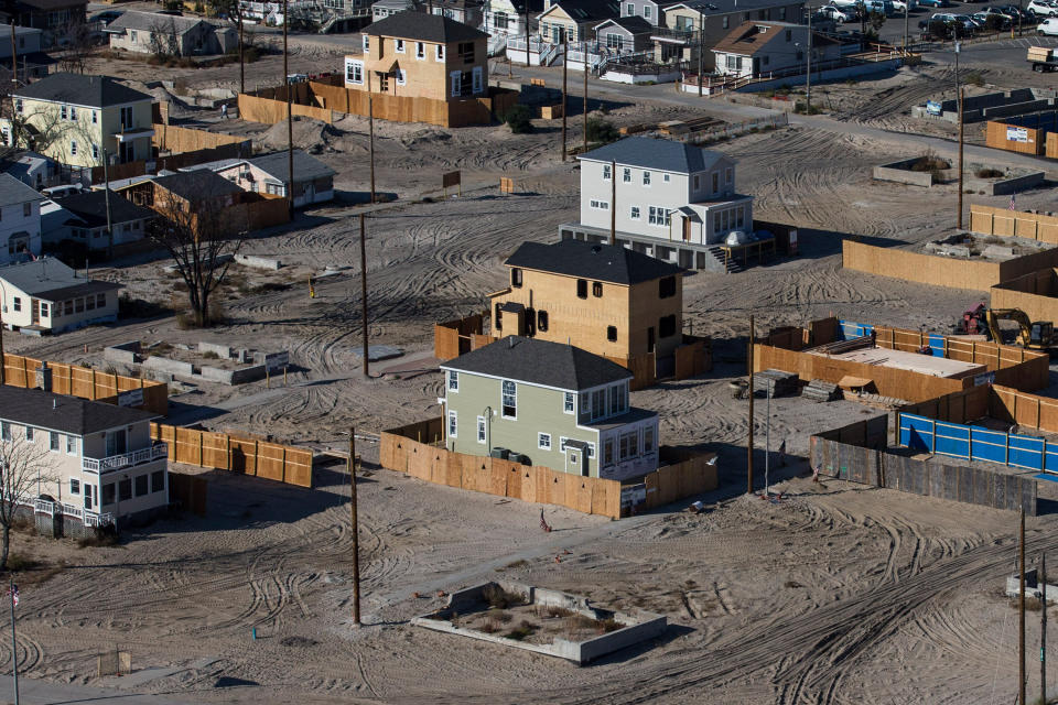 Homes sit under construction one year after being destroyed by Superstorm Sandy in the Breezy Point neighborhood of Queens, New York City. (Photo: Andrew Burton via Getty Images)