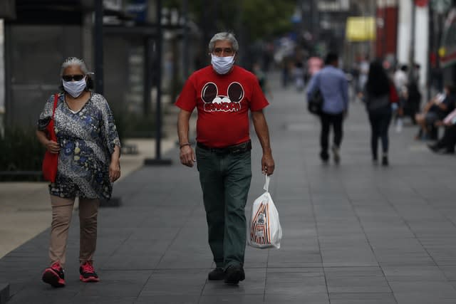 People stroll down Juarez Avenue in central Mexico City