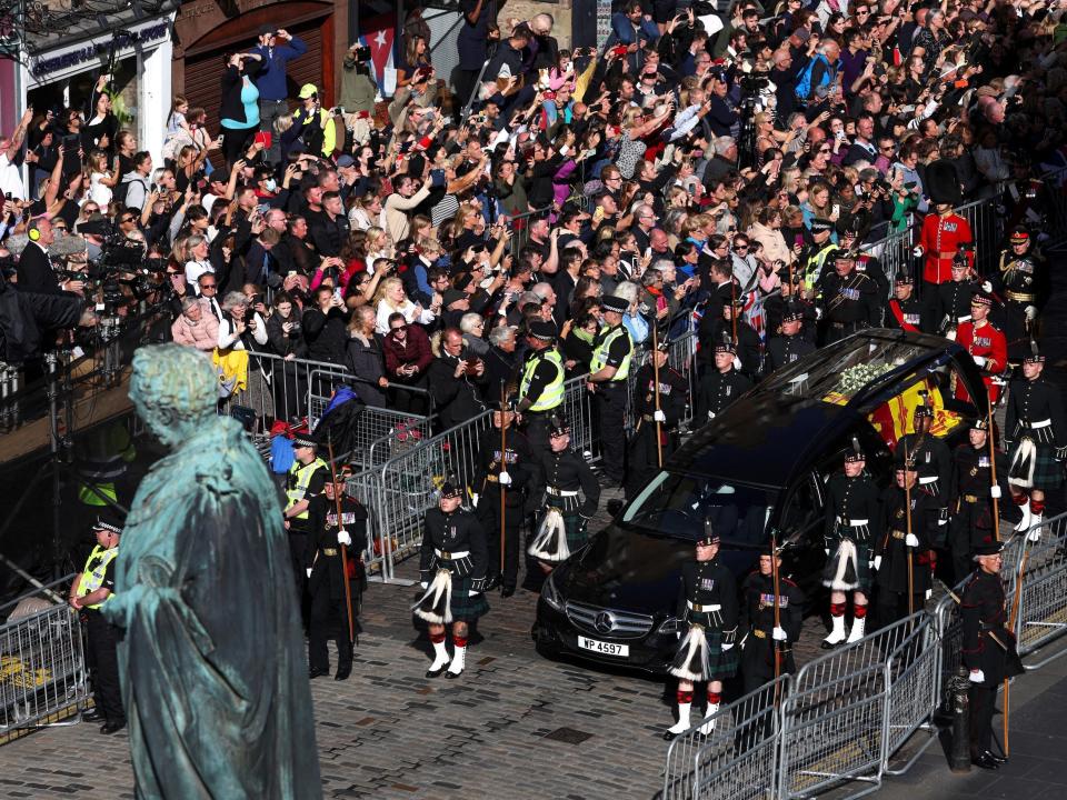 The hearse carrying the coffin of Queen Elizabeth ll arrives at St. Giles' Cathedral on September 12, 2022 in Edinburgh, Scotland. King Charles III joins the procession accompanying Her Majesty The Queen's coffin from the Palace of Holyroodhouse along the Royal Mile to St Giles Cathedral. The King and The Queen Consort, accompanied by other Members of the Royal Family also attend a Service of Prayer and Reflection for the Life of The Queen where it lies in rest for 24 hours before being transferred by air to London.