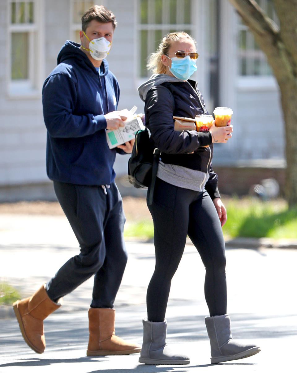 <p>Scarlett Johansson and fiancé Colin Jost twin in hoodies and Ugg boots as they fuel up on an iced coffee run Wednesday in The Hamptons.</p>