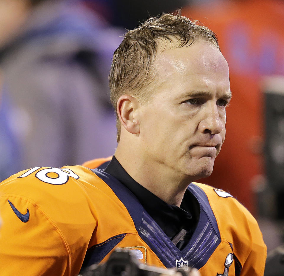 FILE - In this Feb. 2, 2014 file photo, Denver Broncos' Peyton Manning walks off the field after the NFL Super Bowl XLVIII football game against the Seattle Seahawks in East Rutherford, N.J. Manning delivers the keynote address at the Boy Scouts of America's annual breakfast Wednesday, April 16, 2014 in Denver, and makes his first public comments since the Denver Broncos were trounced by Seattle from the opening snap of the Super Bowl. (AP Photo/Chris O'Meara, File)