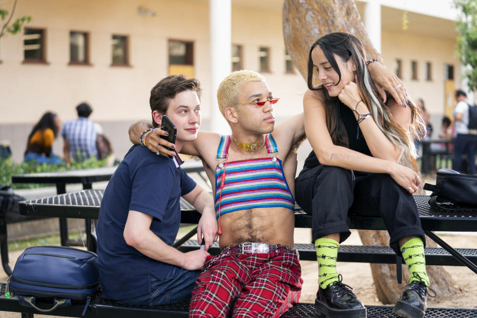 Nathan (Uly Schlesinger), Chester (Justice Smith) and Riley (Chase Sui Wonders) are all hugging on a school bench in BINGE's Genera+ion.