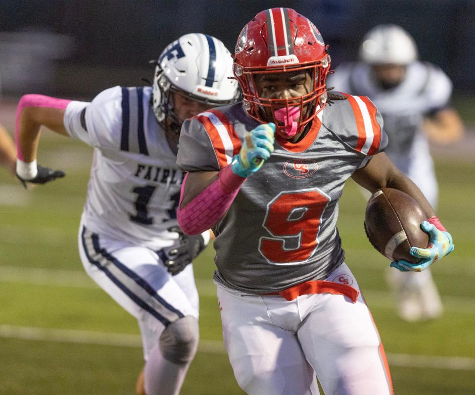 Canton South's Rome Cox runs for a gain during the first half of Friday's game against Fairless.