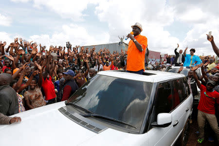 Kenyan opposition leader Raila Odinga of the National Super Alliance (NASA) coalition addresses his supporters after attending a church service in Kawangware slums in Nairobi, Kenya October 29, 2017. REUTERS/Thomas Mukoya