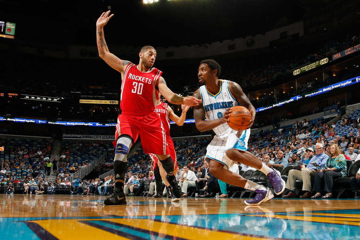 NEW ORLEANS, LA - OCTOBER 24:  Roger Mason Jr. #8 of the New Orleans Hornets drives the ball around Royce White #30 of the Houston Rockets at New Orleans Arena on October 24, 2012 in New Orleans, Louisiana.  NOTE TO USER: User expressly acknowledges and agrees that, by downloading and or using this photograph, User is consenting to the terms and conditions of the Getty Images License Agreement.  (Photo by Chris Graythen/Getty Images)