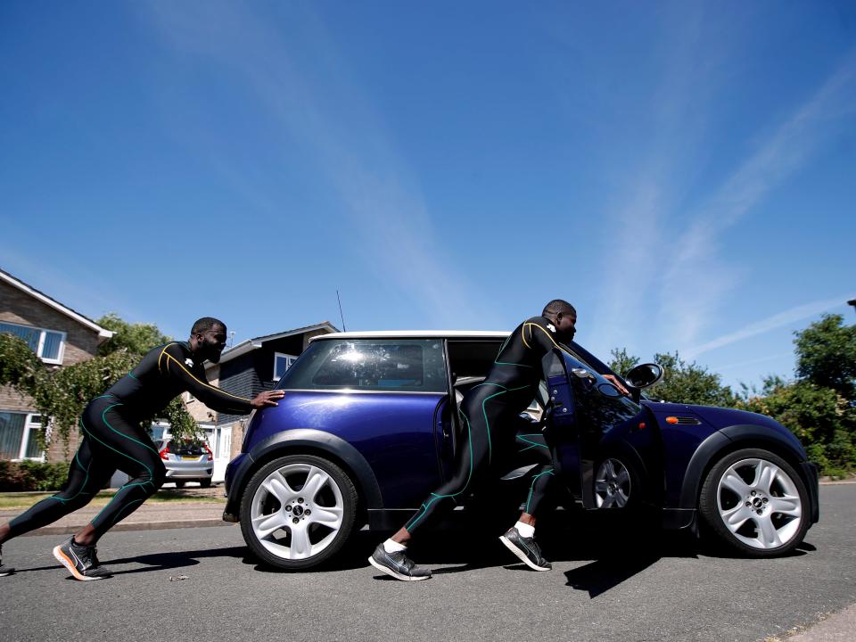 Jamaica Bobsleigh team pushing Mini Cooper