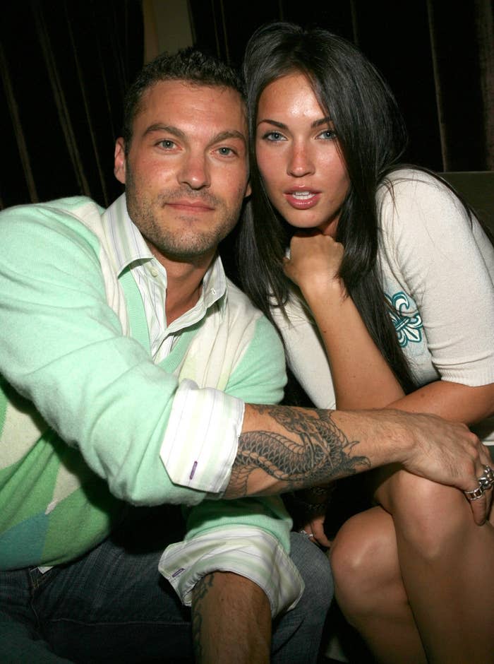 Brian Austin Green and Megan Fox sitting closely, looking at the camera