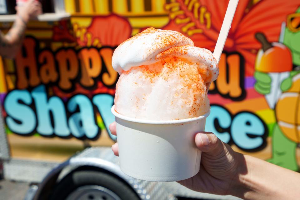 Happy Honu's "Hawaiian Paradise" shave ice is flavored with passion fruit, orange, guava, lilikoi and haupia, and topped with haupia whip and li hing mui powder; April 16, 2022; Glendale, AZ.