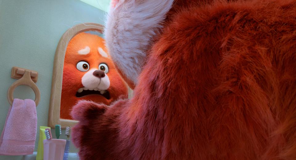 Teenage Mei Lee (Rosalie Chiang) freaks out when she wakes up one morning as an 8-foot-tall giant red panda in Pixar's coming-of-age animated film "Turning Red."