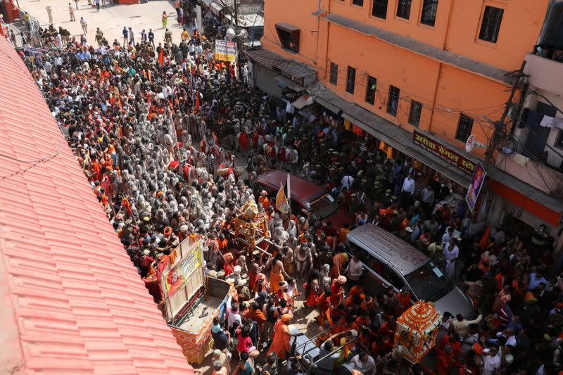 Naga Sadhus, or Hindu holy men, leave the banks of the Ganges river after the first Shahi Snan at "Kumbh Mela", or the Pitcher Festival, in Haridwar