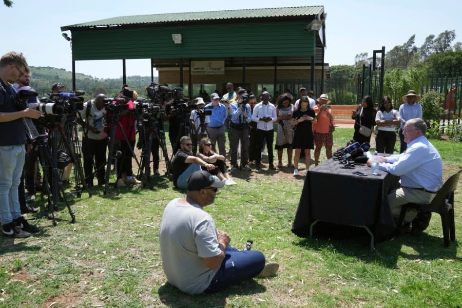 Rob Mathews, the Steenkamp family representative, reads the witness impact statement submitted to the parole body looking into the possible release of Oscar Pistorius, outside the Atteridgeville Prison, in Pretoria, South Africa, Friday, Nov. 24, 2023. The double-amputee Olympic runner was convicted of a charge comparable to third-degree murder for shooting Reeva Steenkamp in his home in 2013. (AP Photo/ Tsvangirayi Mukwazhi)