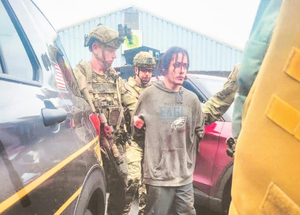 A photograph taken by law enforcement after the apprehension of escapee Danelo Cavalcante is displayed at a press conference held at the Po-Mar-Lin Fire Company in Unionville, Pa., on Sept. 13, 2023.