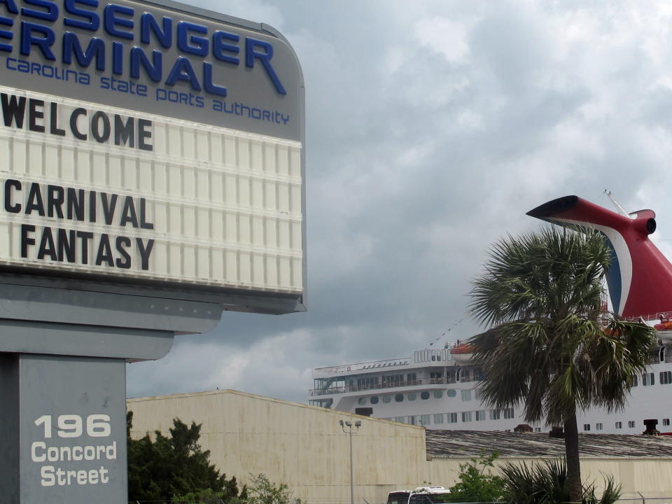 This April 18, 2012, photo shows the Carnival Fantasy in a port at the South Carolina State Ports Authority terminal in Charleston, S.C. For more than two years the debate over cruise ships calling year-round in Charleston has raged with a state Supreme Court case, conflicting economic studies and rhetoric. Preservationists cite the threat to the city's historic character while cruise supporters say the industry is being administered appropriately and provides needed jobs and a boost to the local economy. (AP Photo/Bruce Smith)