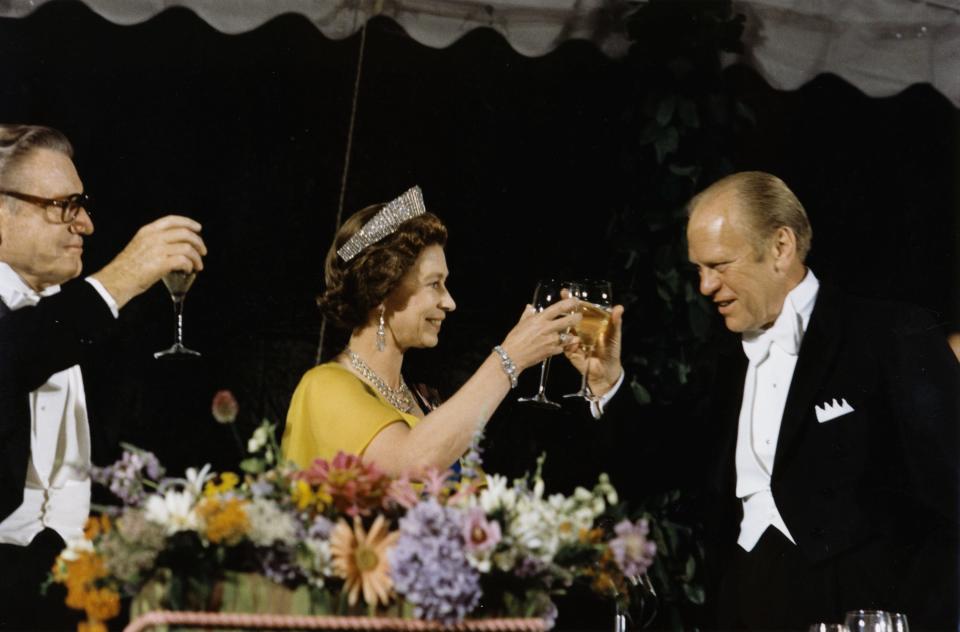 This photograph shows President Gerald R. Ford and Queen Elizabeth II of the United Kingdom during the toast she made at the State Dinner held in her honor in the Rose Garden.