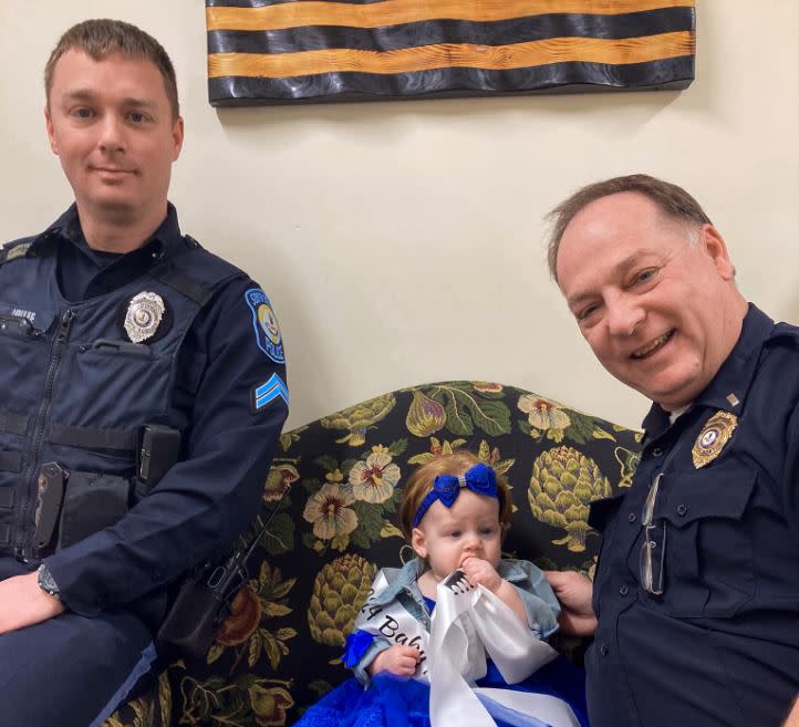 Baby Miss Virginia Adalynd with local law enforcement at the South Boston Police Department. (Photo courtesy: South Boston Police Department)