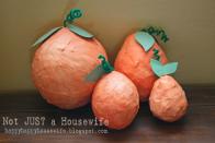 <p>This timeless paper mache project never goes out of style and can be adapted to all seasons. To make pumpkins, simply water down some white glue and soak paper strips in it. Then use the strips to cover inflated balloons. Top with green paper leaves and pipe cleaner stems.</p><p><em><a href="https://www.notjustahousewife.net/paper-mache-pumpkins/" rel="nofollow noopener" target="_blank" data-ylk="slk:Get the tutorial at Stacy Risenmay Not Just a Housewife »;elm:context_link;itc:0;sec:content-canvas" class="link ">Get the tutorial at Stacy Risenmay Not Just a Housewife »</a></em><br></p>