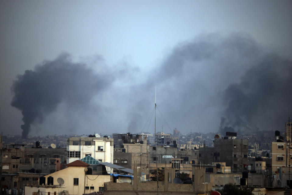 Smoke rises from the town of Khan Younis after Israeli strikes on Tuesday, Dec. 12, 2023. (AP Photo/Mohammed Dahman)
