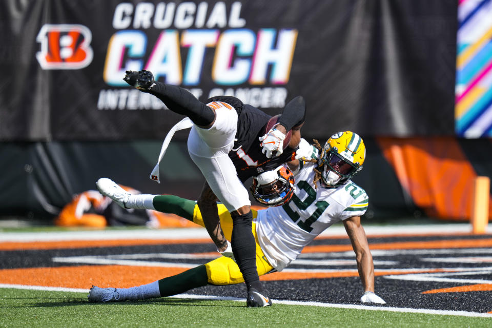 CORRECTS TO FLIPS INTO THE END ZONE ON A FAILED TOUCHDOWN-ATTEMPT NOT FOR A TOUCHDOWN - Cincinnati Bengals wide receiver Ja'Marr Chase (1) flips into the end zone on a failed touchdown-attempt as he is hit by Green Bay Packers cornerback Eric Stokes (21) in the second half of an NFL football game in Cincinnati, Sunday, Oct. 10, 2021. (AP Photo/AJ Mast)