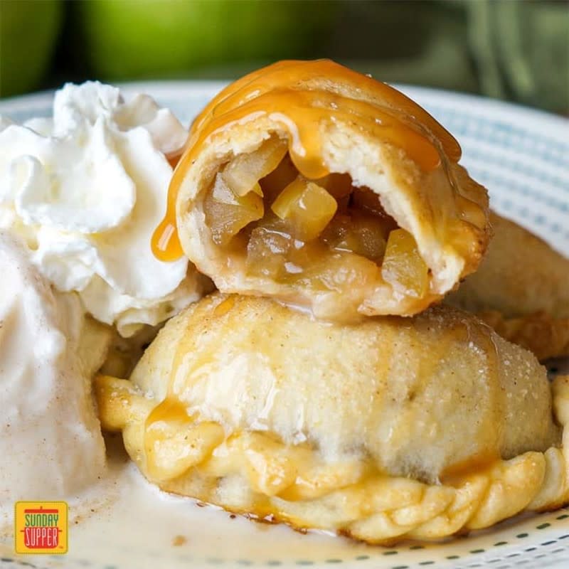 <p>Sunday Supper Movement</p><p> Complete with Granny Smith apples cooked in a spiced caramel sauce and a flaky, buttery pie crust, they are the best caramel apple hand pies ever.</p><p><strong>Get the recipe: </strong><a href="https://sundaysuppermovement.com/caramel-apple-empanadas/" rel="nofollow noopener" target="_blank" data-ylk="slk:Caramel Apple Empanadas;elm:context_link;itc:0;sec:content-canvas" class="link rapid-noclick-resp">Caramel Apple Empanadas</a></p>