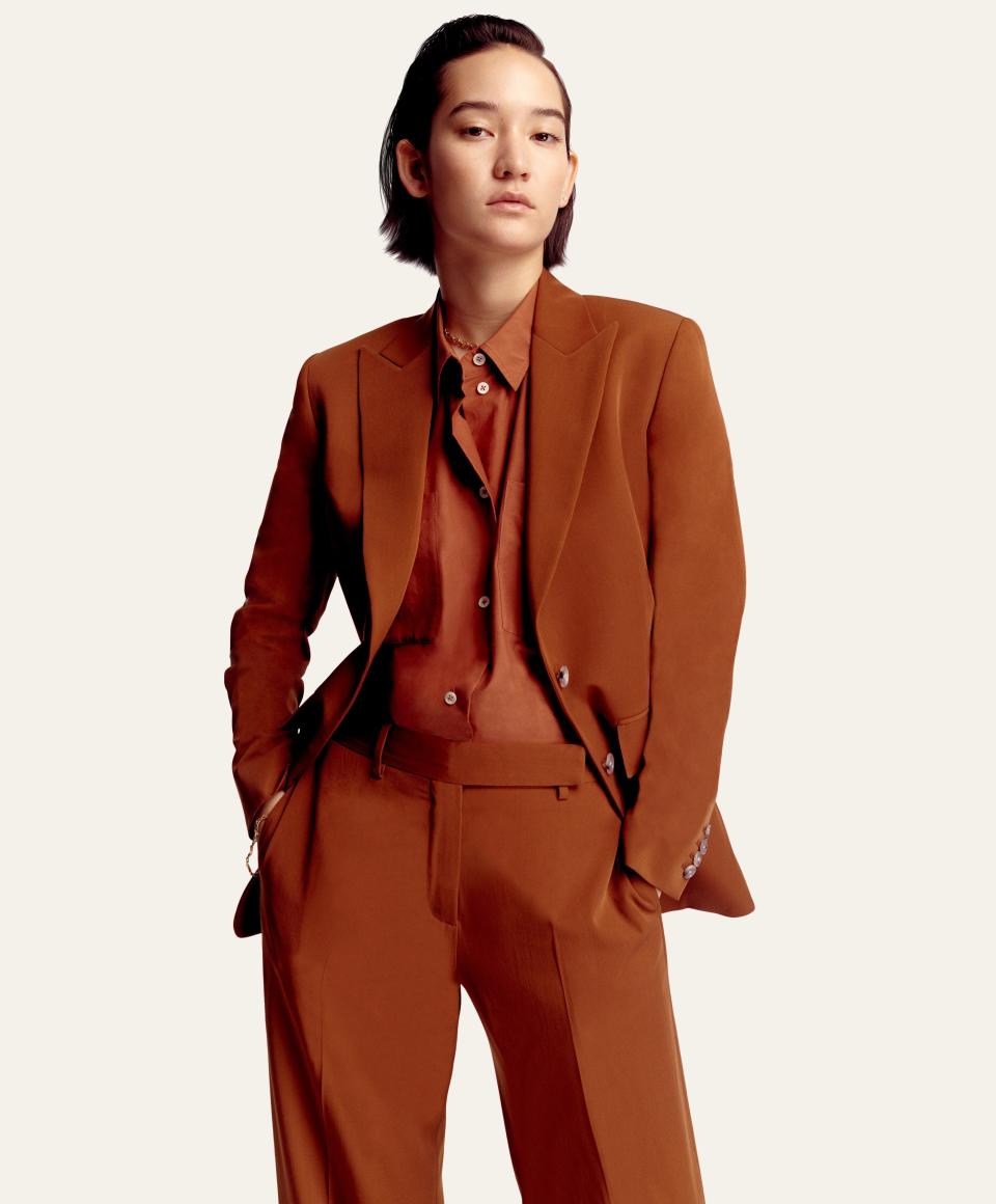 Mona wears menswear throughout (not counting the occasional high heel).  The Espresso Suit:
Blazer, $1,295, shirt, $350, and pants, $650, by Paul Smith / Necklace, her own bracelet, $2,200, by David Yurman