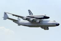 <p>You know those planes that fly with a space shuttle on their backs? Well the Antonov An-225 Mriya is the biggest of them all. It holds the world record for the largest single-item payload, 418,834 pounds, as well as the record for total airlifted payload—559,577 pounds, or 280 tons. Only one of these monsters was built in the late 1980s by the Soviet Union in what is now Ukraine. </p>