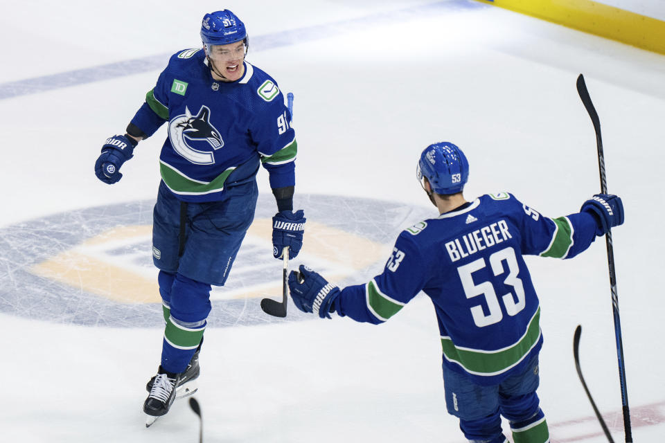 Vancouver Canucks' Nikita Zadorov celebrates his goal against the Edmonton Oilers with Teddy Blueger during the third period of Game 1 of a second-round NHL hockey Stanley Cup playoffs series, Wednesday, May 8, 2024, in Vancouver, British Columbia. (Ethan Cairns/The Canadian Press via AP)