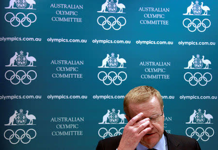 FILE PHOTO - John Coates, President of the Australian Olympic Committee (AOC), reacts as he announces the findings of a probe into the conduct of Australian swimming team members in the run-up to the 2012 London Games, at a media conference in Sydney August 23, 2013. REUTERS/David Gray/File Photo