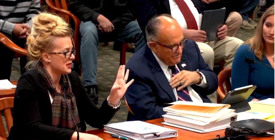 Mellissa Carone, left, joined Trump campaign attorneys Rudy Giuliani and Jenna Ellis at a Michigan legislative hearing in December. She is one of several people Dominion Voting Systems has accused of spreading misinformation about the vote tabulating company.