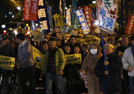 Protesters shout slogans during a march against the government's planned secrecy law in Tokyo November 21, 2013. REUTERS/Issei Kato