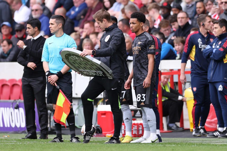 Ethan Nwaneri of Arsenal waits to be substituted on during the Premier League match between Brentford FC and Arsenal FC at Brentford Community Stadium on September 18, 2022 in Brentford, United Kingdom.