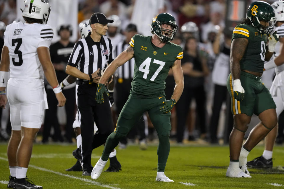 Baylor safety Caleb Parker (47) celebrates after making a tackle during the first half of an NCAA college football game against Iowa State, Saturday, Oct. 5, 2024, in Ames, Iowa. (AP Photo/Charlie Neibergall)