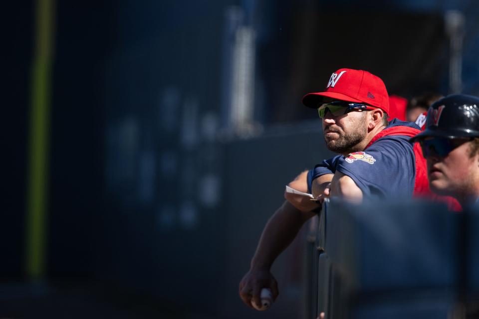 WooSox manager Chad Tracy watches a game versus the Syracuse Mets from the dugout in September.